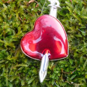Impaled red heart charm necklace on silver chain